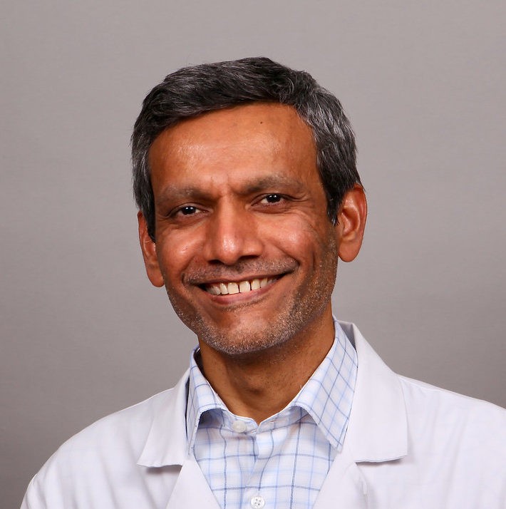 a headshot of Dr. Sudhir Hansalia.